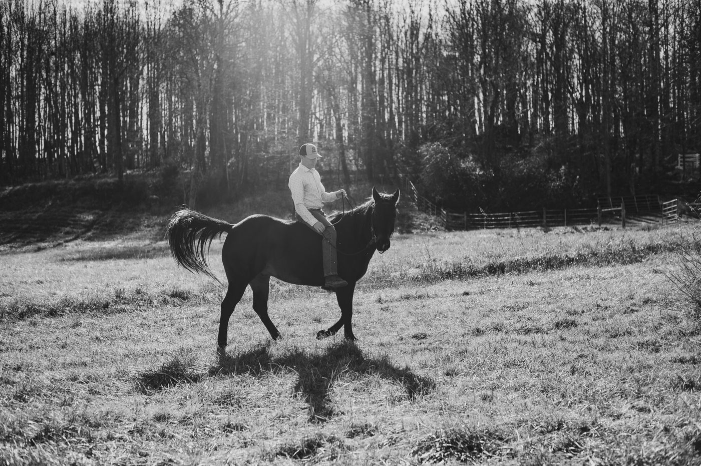 Whitney Sewell riding a horse across a field